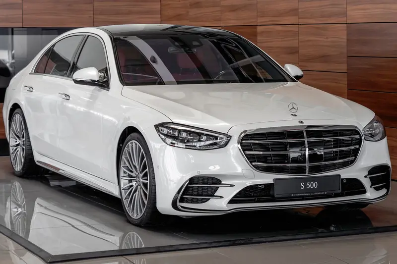 A white Mercedes-Benz S-Class ready for delivery